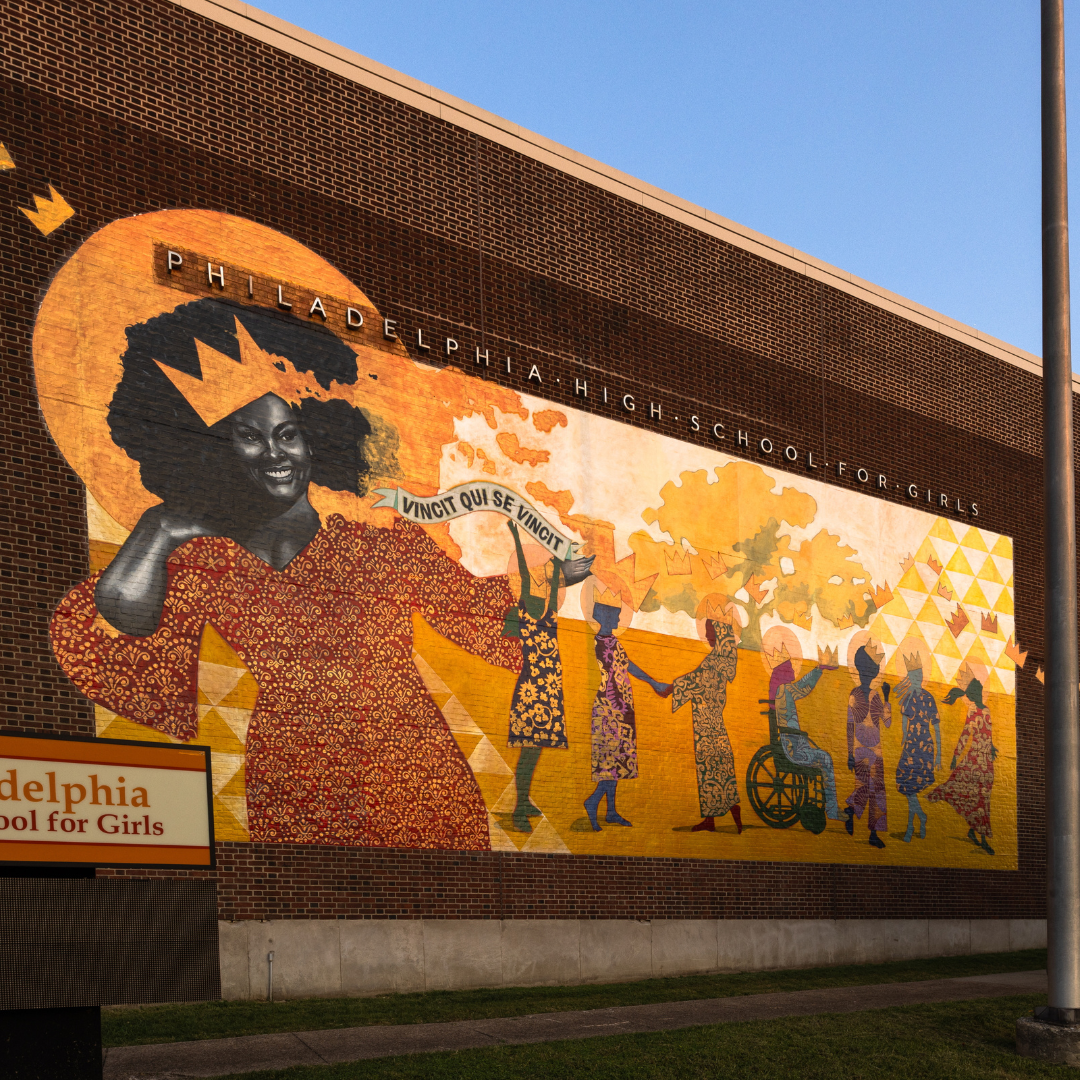 A large, dark, and light orange mural of a woman and several others standing.