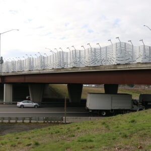 An overpass with steel panels, exhibiting curving line cutouts