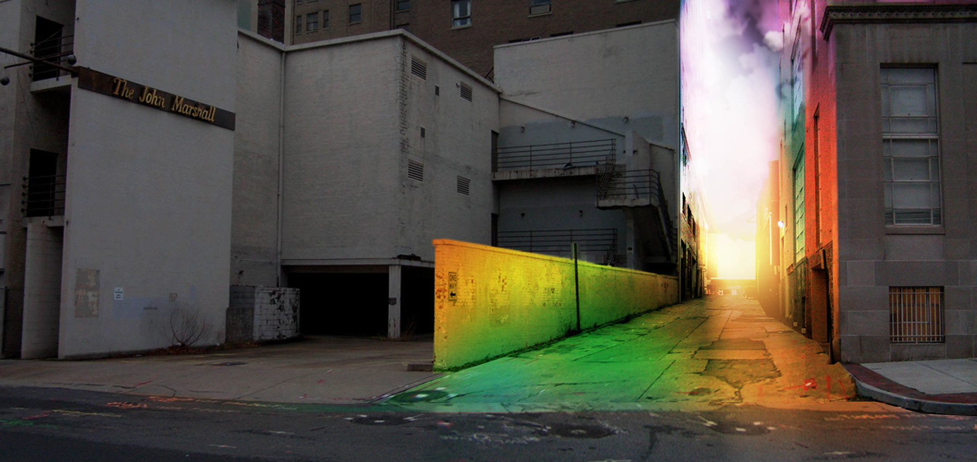 Urban alleyway with brightly colored walls and illuminating sky.