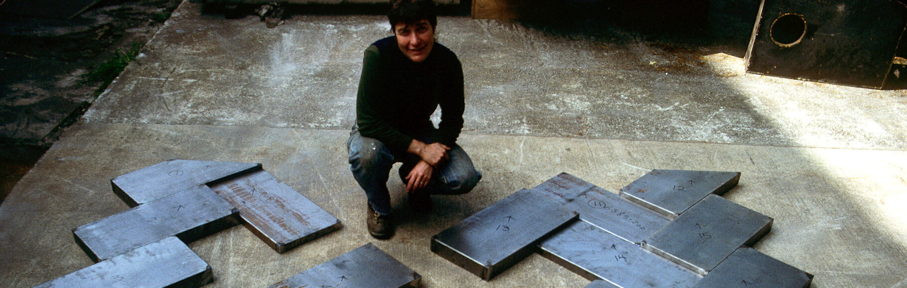 <h3>1984, Bonnie Bronson poses with her work for Southern Oregon University in the fabrication process</h3>