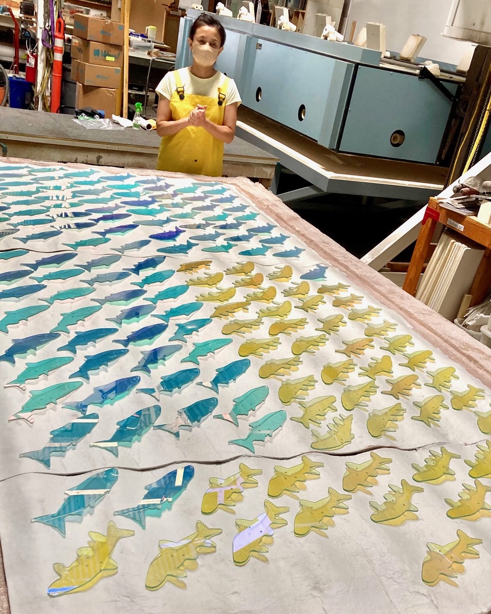 <h3>2024, Kana Tanaka stands in front of the fabricated fish for her sculpture Shoal of Returning Hope at Oregon Institute of Technology in Klamath Falls</h3>